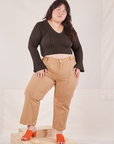 Ashley is wearing Bell Sleeve Top in Espresso Brown and tan Work Pants