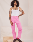 Jesse is wearing Carpenter Jeans in Bubblegum Pink and Cropped Cami in vintage tee off-white