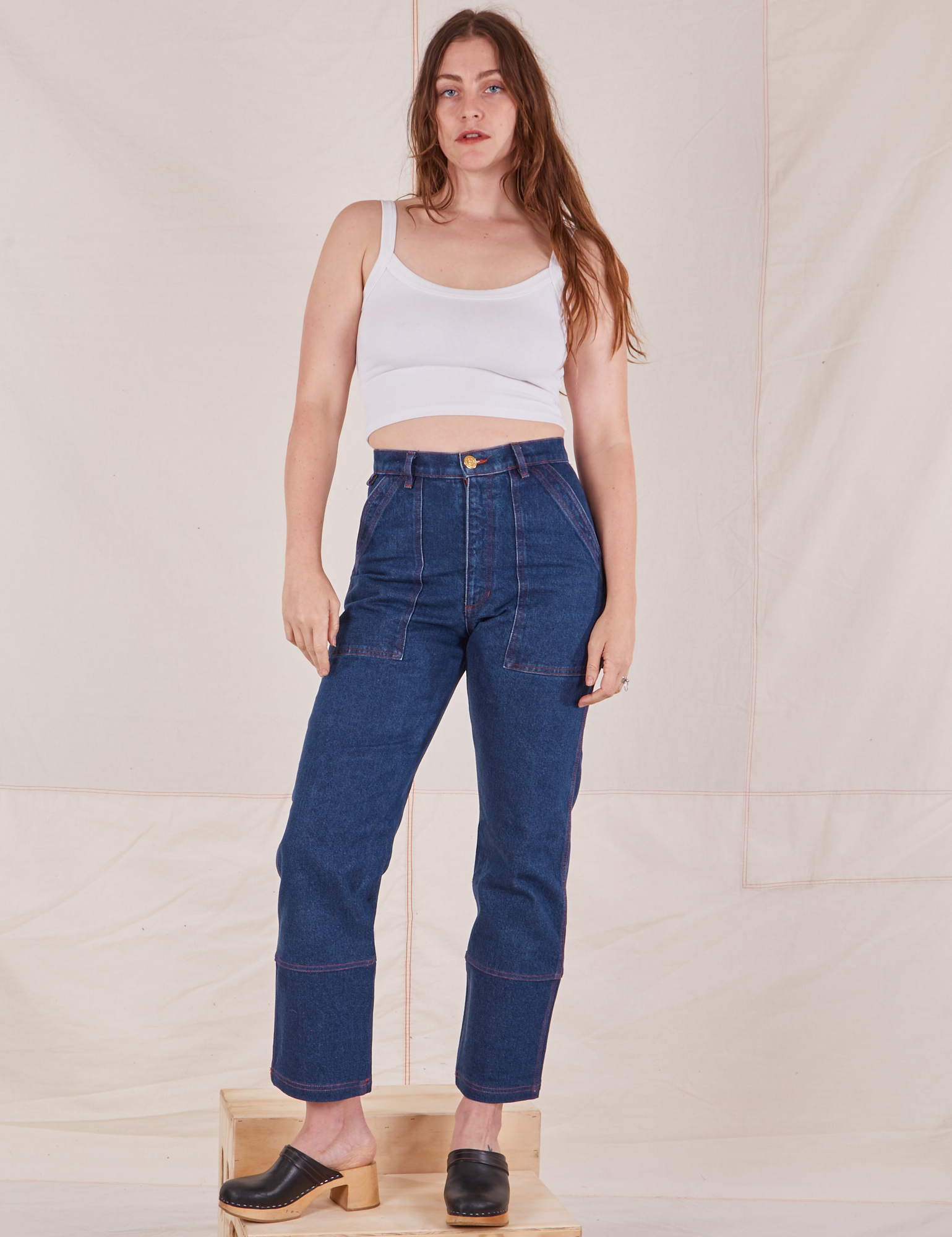 Allison is 5&#39;10&quot; and wearing S Carpenter Jeans in Dark Wash paired with Cropped Cami in vintage tee off-white