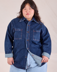Ashley is wearing a buttoned up Denim Overshirt in Dark Wash