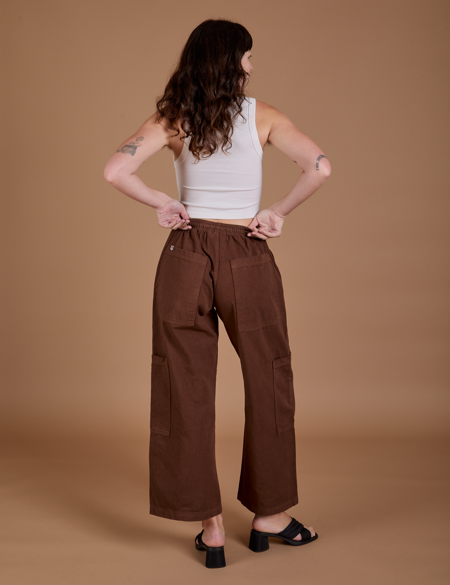 Drop Pocket Cargo Pants in Fudgesicle Brown back view on Alex