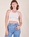 Alex is 5'8" and wearing P Halter Top in Vintage Tee Off-White paired with light wash Frontier Pants