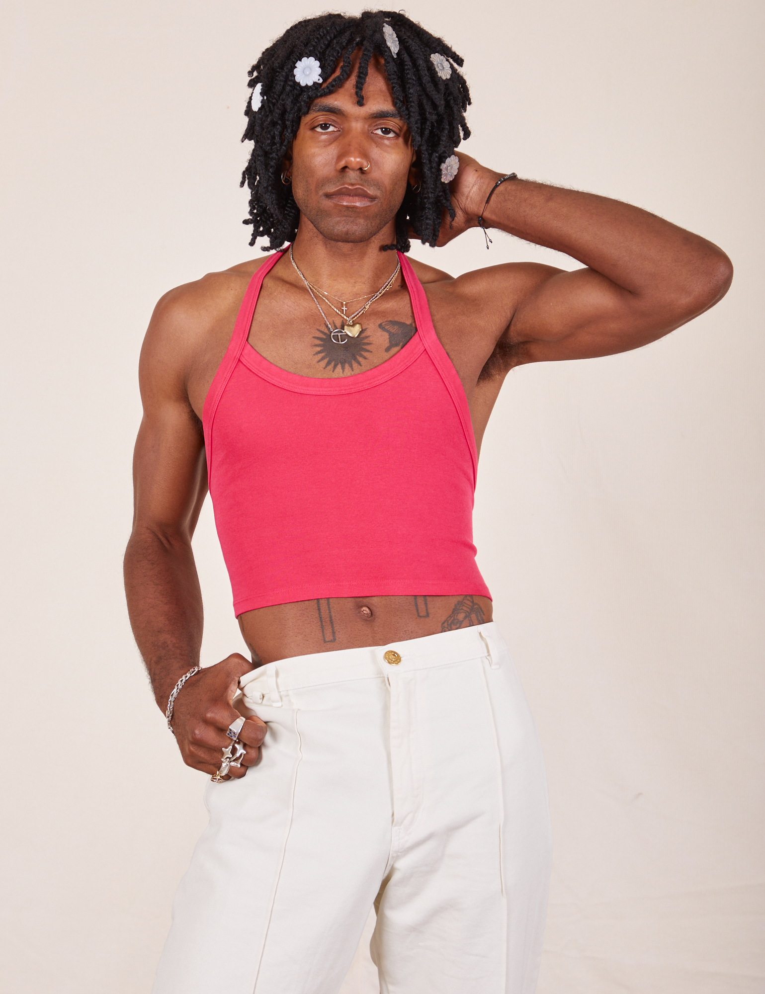 Jerrod is 6&#39;3&quot; and wearing XS Halter Top in Hot Pink paired with vintage off-white Western Pants