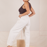Side view of Heavyweight Trousers in Vintage Off-White and espresso brown Cropped Tank Top worn by Tiara.