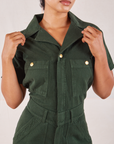 Heritage Short Sleeve Jumpsuit in Swamp Green front close up on Mika