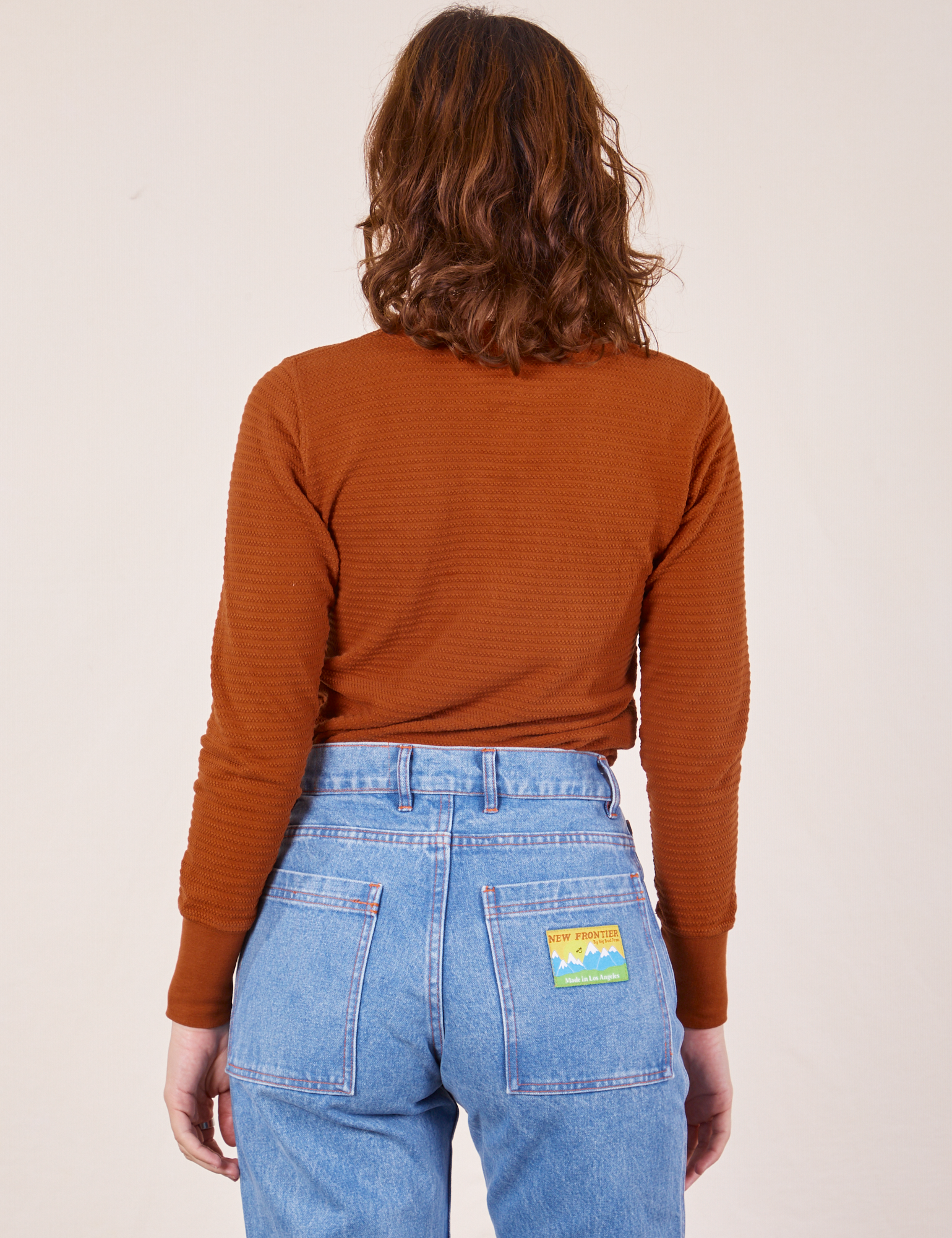 Back view of Honeycomb Thermal in Burnt Terracotta worn by Alex
