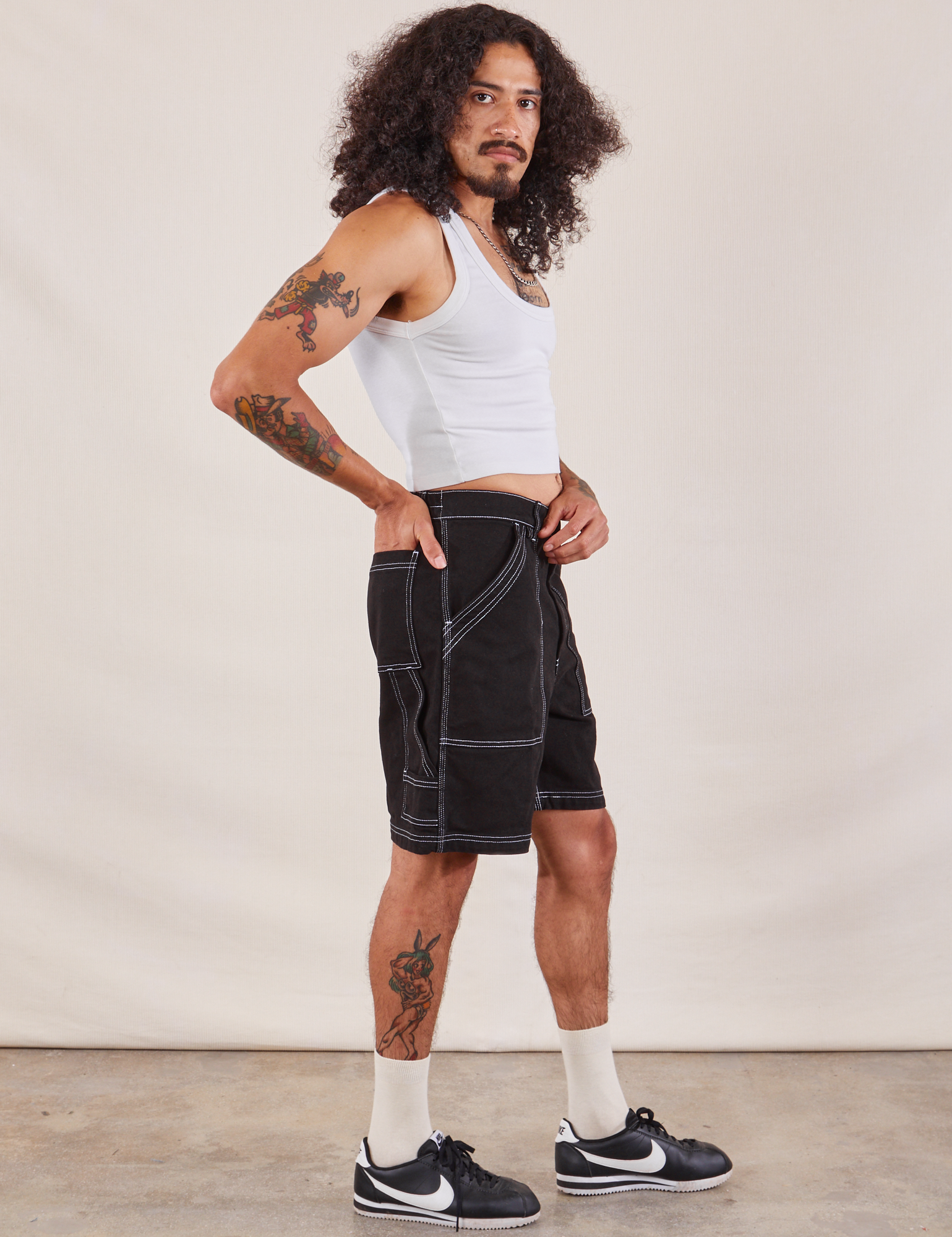Side view of Carpenter Shorts in Basic Black and Cropped Tank in vintage tee off-white on Jesse