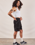 Side view of Carpenter Shorts in Basic Black and Cropped Tank in vintage tee off-white on Jesse