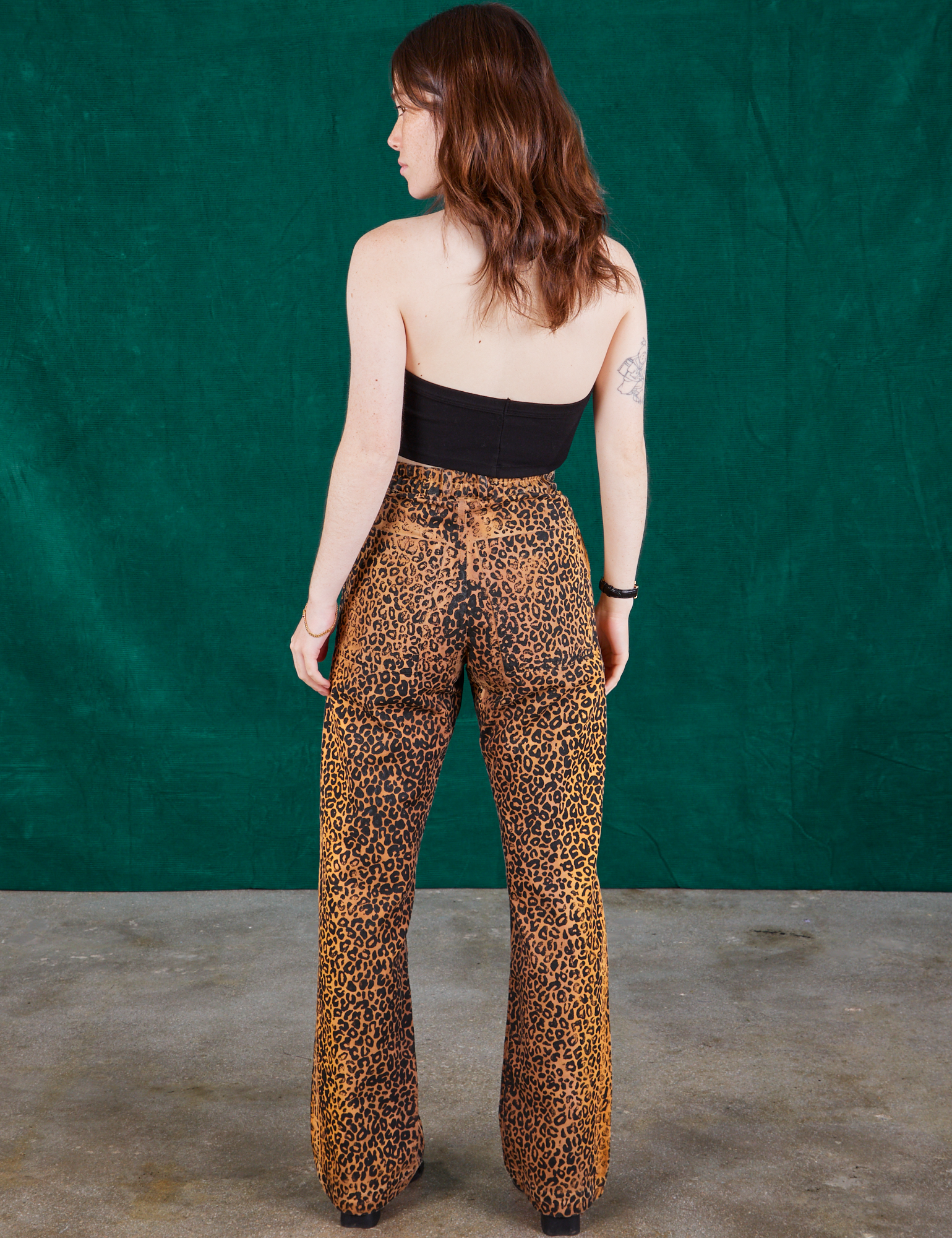 Back view of Leopard Work Pants and black Halter Top on Hana