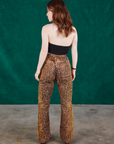 Back view of Leopard Work Pants and black Halter Top on Hana