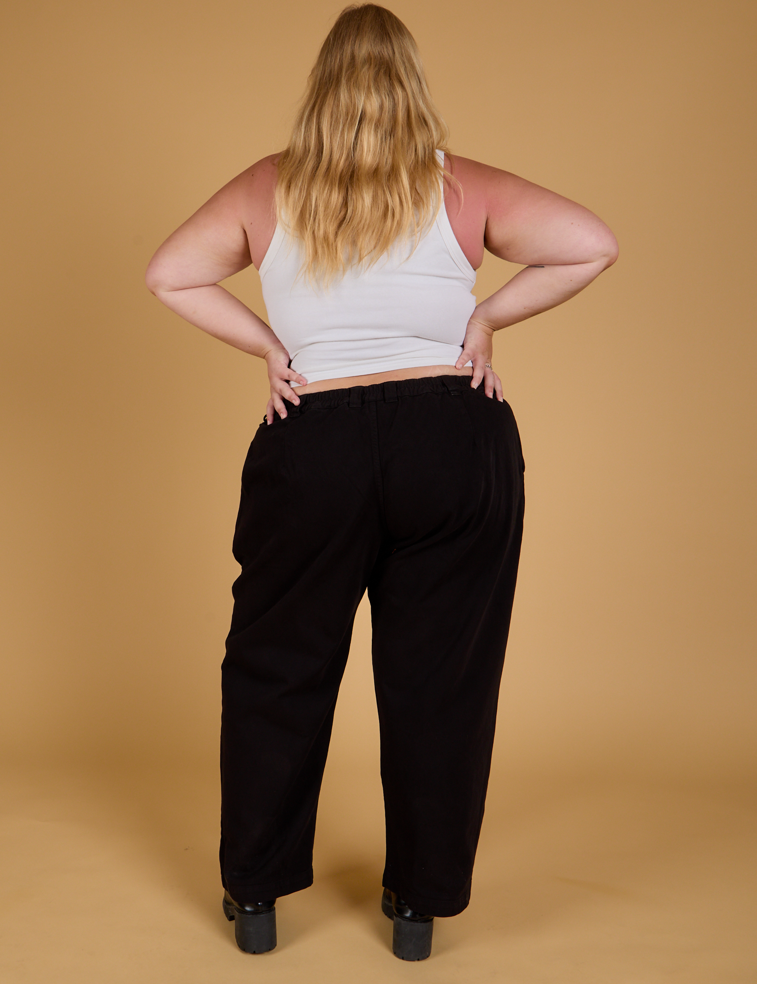 Baggy Mid-Rise Trousers in Basic Black back view on Juliet