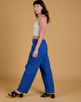 Baggy Mid-Rise Trousers in Royal Blue side view on Alex