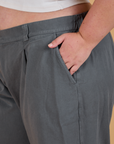 Close up of Juliet's hand in the front pocket of Baggy Mid-Rise Trousers in Slate Grey