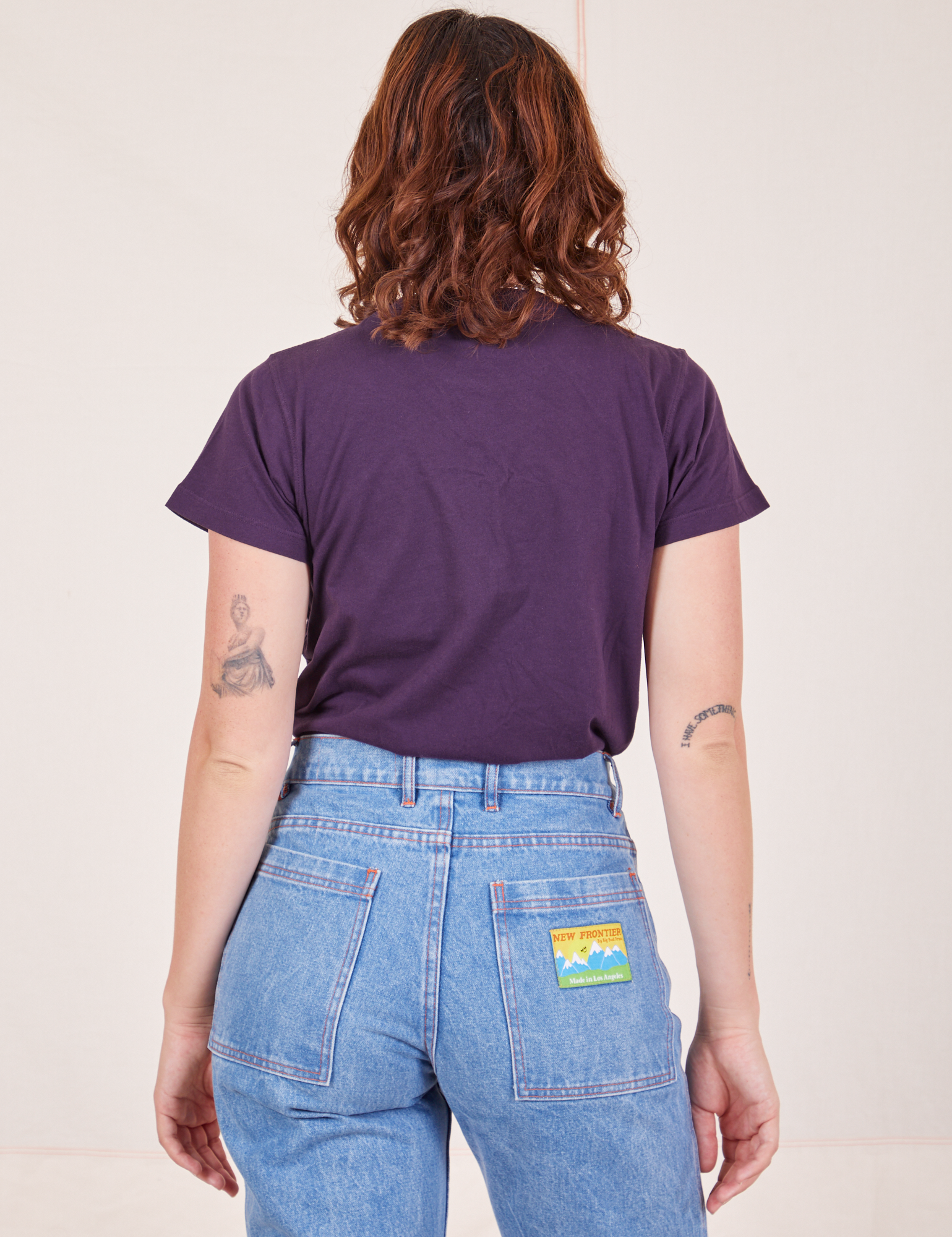 Back view of The Organic Vintage Tee in Nebula Purple worn by Alex