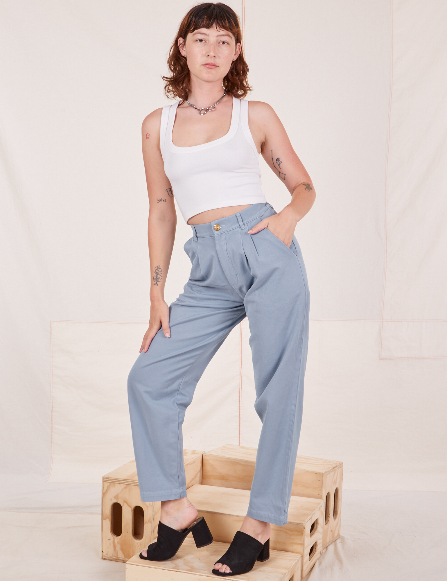 Alex is 5&#39;8&quot; and wearing XXS Organic Trousers in Periwinkle paired with Cropped Tank Top in vintage tee off-white