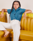 Gabi is wearing Pantry Button-Up in Marine Blue and vintage tee off-white Western Pants