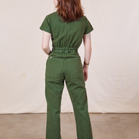 Petite Short Sleeve Jumpsuit in Dark Emerald Green back view on Hana