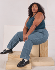 Morgan is wearing Railroad Carpenter Jeans in Baby Blue and marine blue Muscle Tee