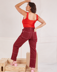 Back view of Railroad Carpenter Jeans in Mustang Red and mustang red Square Neck Tank on Tiara