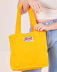 Shopper Tote Bag in Sunshine Yellow worn on arm of Allison