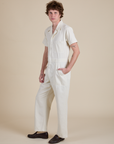 Angled front view of Short Sleeve Jumpsuit in Vintage Tee White on Quinn