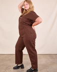 Short Sleeve Jumpsuit in Fudgesicle Brown side view on Juliet