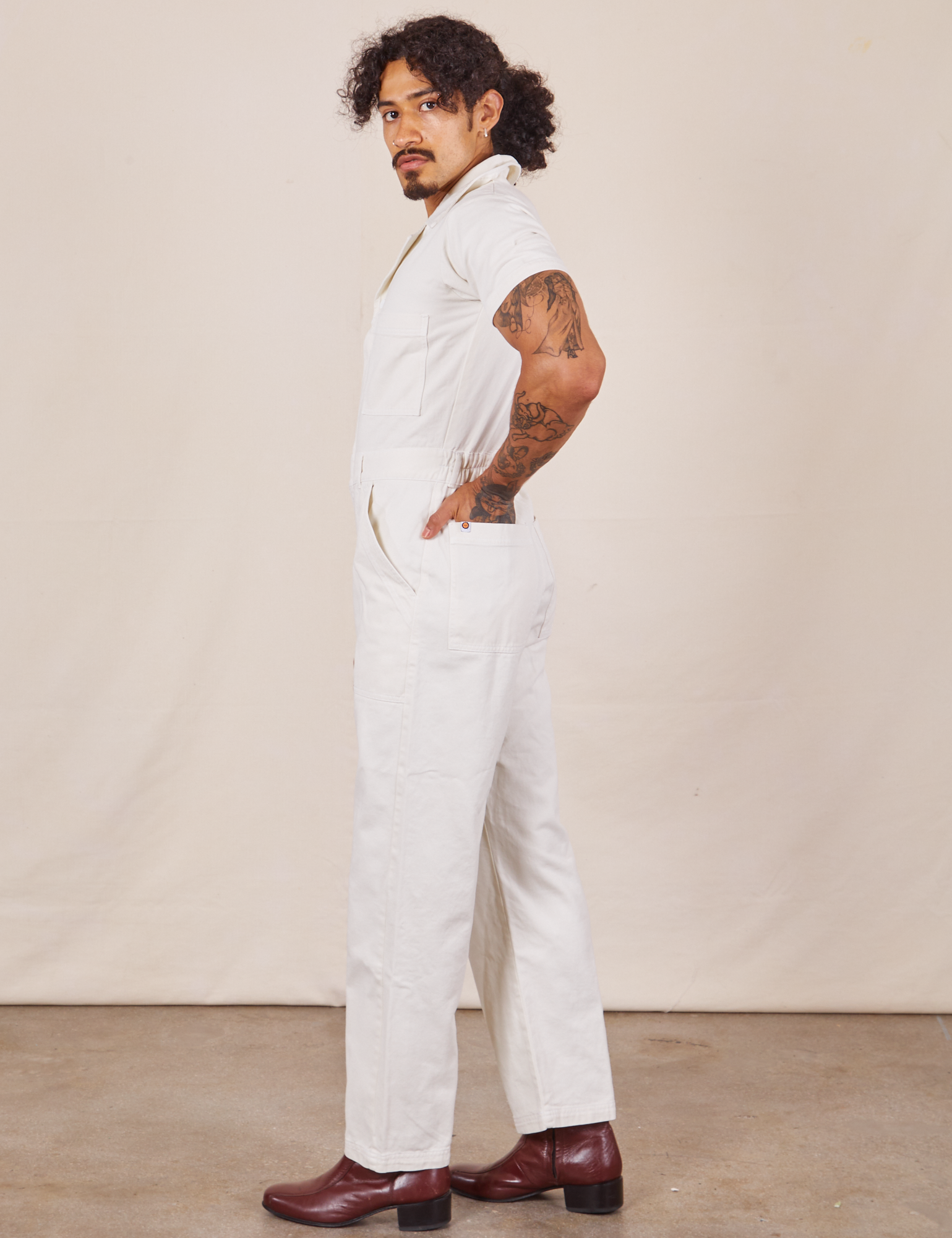 Side view of Short Sleeve Jumpsuit in Vintage Tee Off-White worn by Jesse