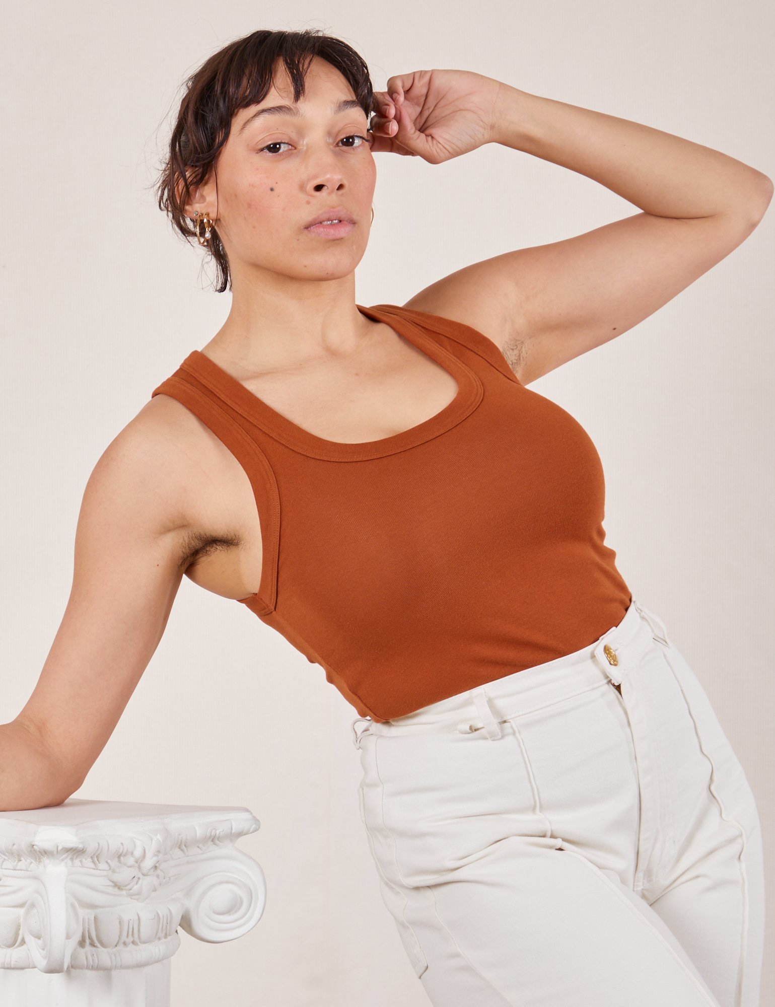 Tiara is wearing Tank Top in Burnt Terracotta and vintage tee off-white Western Pants