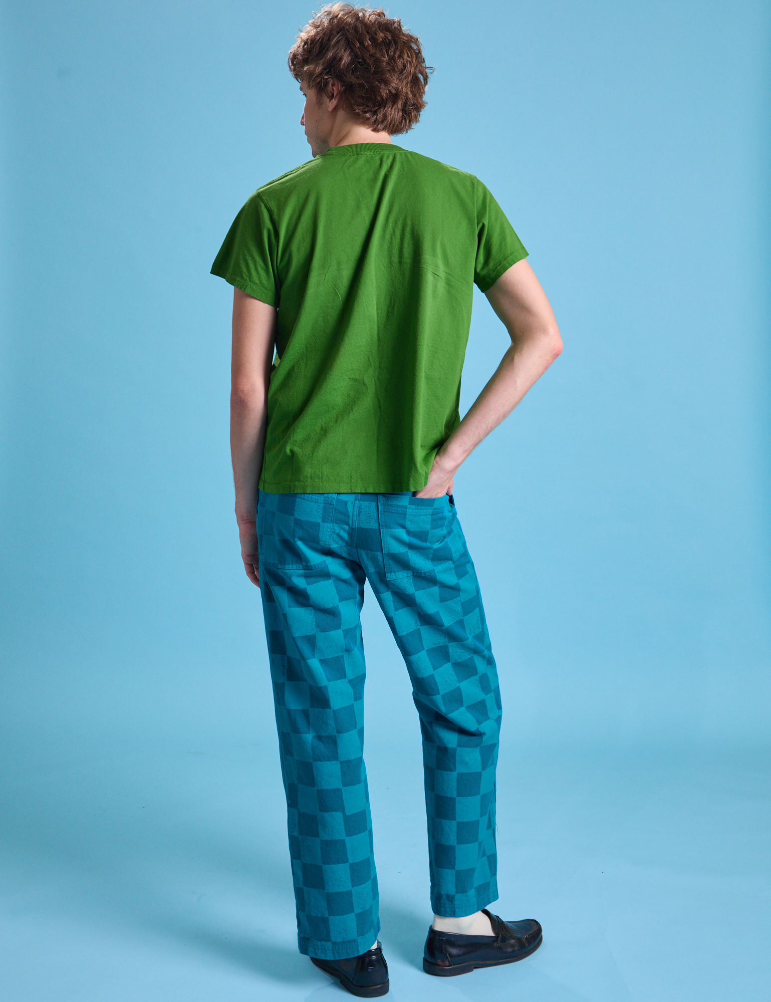 Back view of Checkerboard Work Pants in Blues and lawn green Organic Vintage Tee