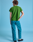 Back view of Checkerboard Work Pants in Blues and lawn green Organic Vintage Tee