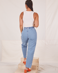 Back view of Denim Trouser Jeans in Light Wash and Tank Top in vintage tee off-white worn by Gabi