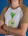 Angled front view close up Produce Raglan Tee in Onion on Grant