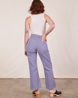 Back view of Western Pants in Faded Grape and Tank Top in vintage tee off-white worn by Alex