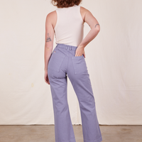 Back view of Western Pants in Faded Grape and vintage off-white Tank Top worn by Alex