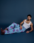 Jesse is wearing Floral Painted Work Pants in Blue and vintage tee white Cropped Tank