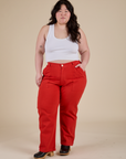 Ashley is 5’7” and wearing 1XL Work Pants in Mustang Red paired with a Cropped Tank in Vintage Tee White