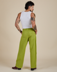 Back view of Work Pants in Gross Green and Cropped Tank in Vintage Tee White on Jesse