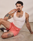 Jesse is wearing Classic Work Shorts in Flamingo Pink and Tank Top in Vintage Tee Off-White
