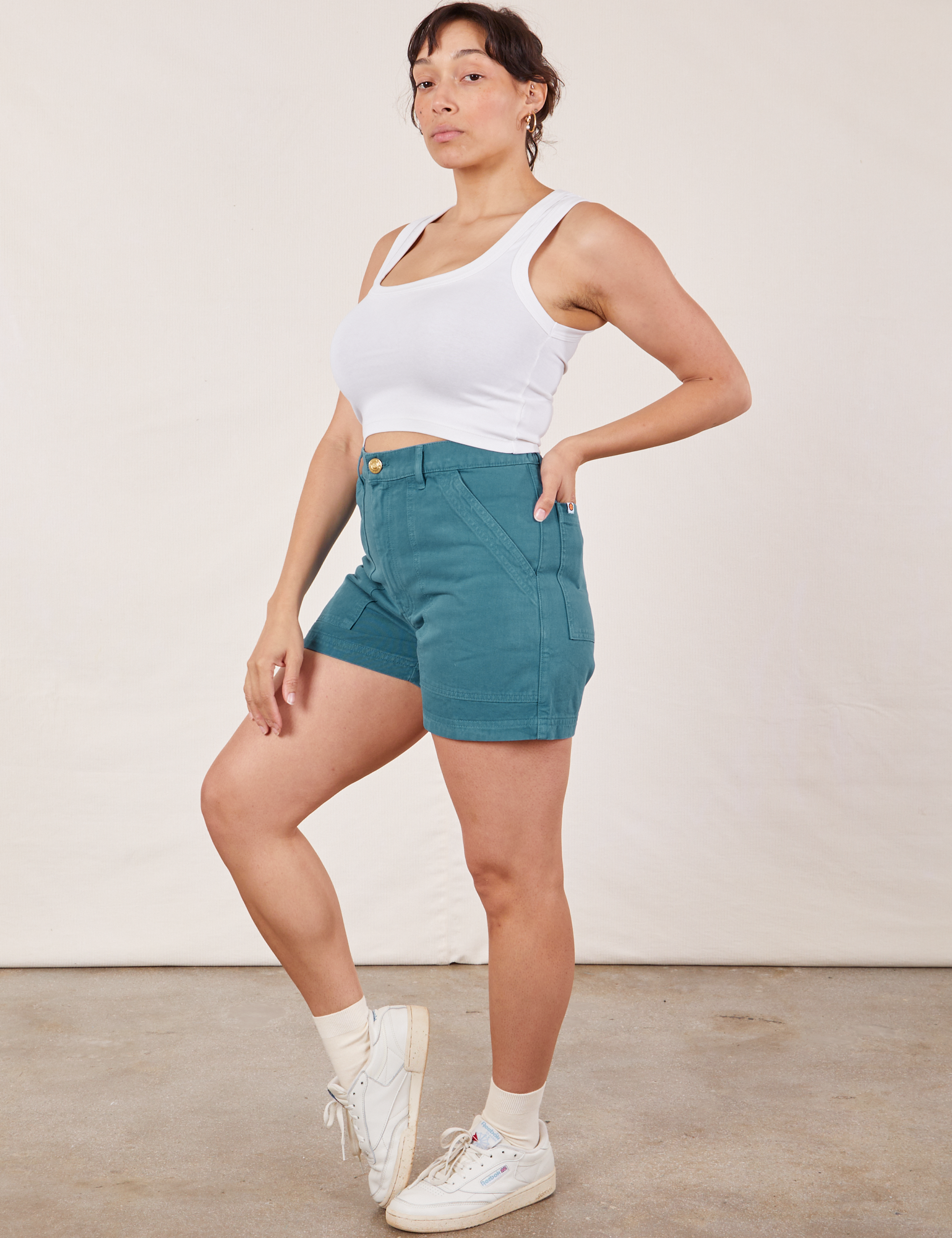 Angled front view of Classic Work Shorts in Marine Blue and Cropped Tank Top in vintage tee off-white on Tiara