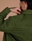 Back shoulder close up of Ripstop Field Coat in Evergreen on Jesse