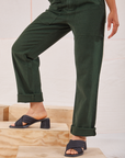 Heritage Short Sleeve Jumpsuit in Swamp Green pant leg close up on Mika
