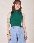 Hana is 5'3" and wearing P Sleeveless Essential Turtleneck in Hunter Green