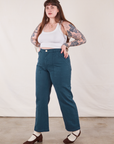 Angled front view of Work Pants in Lagoon and vintage tee off-white Cropped Tank on Sydney