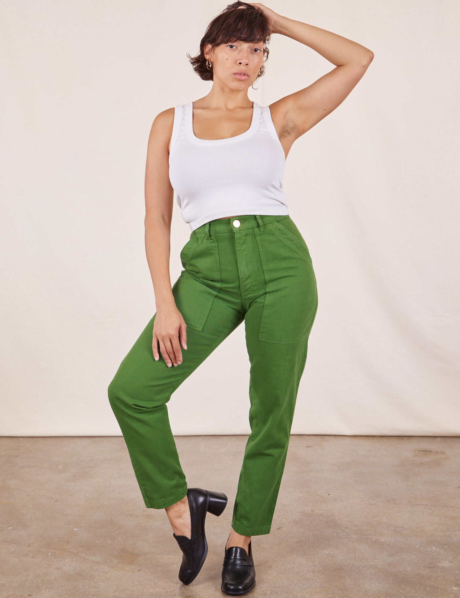 Tiara is 5&#39;4&quot; and wearing XS Pencil Pants in Lawn Green paired with vintage off-white Cropped Tank Top