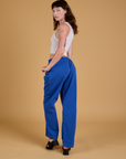 Baggy Mid-Rise Trousers in Royal Blue angled back view on Alex