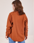 Back view of Oversize Overshirt in Burnt Terracotta worn by Hana