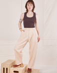 Hana is 5'3" and wearing XXS Petite Heritage Trousers in Vintage Off-White paired with espresso brown Tank Top