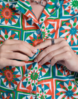 Close up of Alex buttoning up Quilt Print Pantry Button-Up