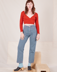 Alex is 5'8" and wearing XS Railroad Stripe Denim Work Pants paired with a paprika Long Sleeve V-Neck Tee