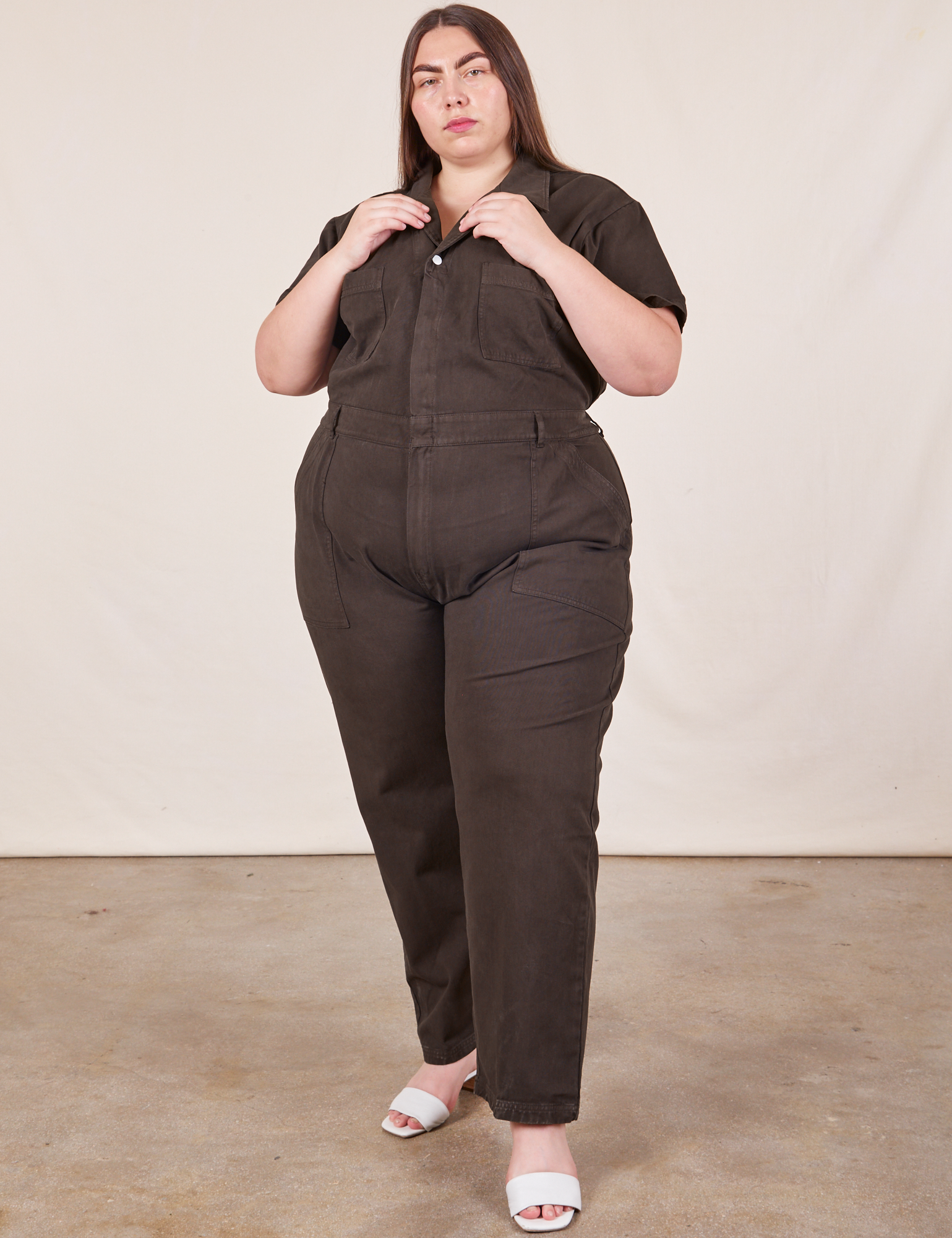 Marielena is wearing Short Sleeve Jumpsuit in Espresso Brown